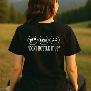 Back view of Zac & Caulay black mental health awareness t-shirt with “Don’t Bottle It Up” slogan and icons